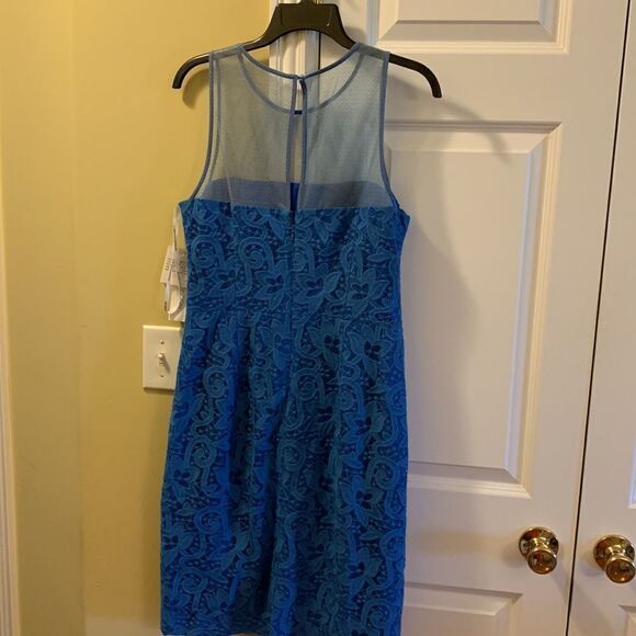 Maggy London size 10 blue lace dress w/sheer above bustline. Royal blue lining Maggy London size 10 blue lace dress w/sheer above bustline. Royal blue lining
